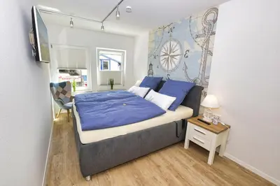 Ein Bett oder Betten in einem Zimmer der Unterkunft Ferienwohnung NORDIA Mitte