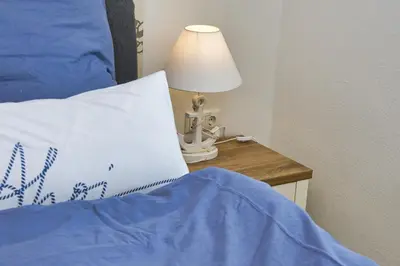 Ein Bett oder Betten in einem Zimmer der Unterkunft Ferienwohnung NORDIA Mitte