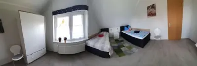 Ein Bett oder Betten in einem Zimmer der Unterkunft Ferienwohnnung Kathrin