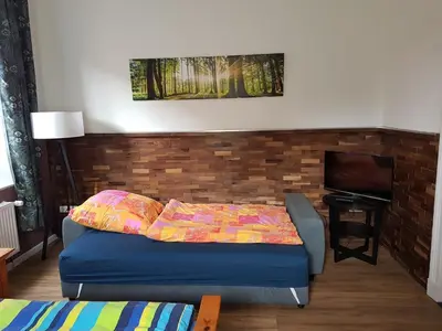 Ein Bett oder Betten in einem Zimmer der Unterkunft Wunderschöne und moderne Altstadtwohnung im Herzen von Otterndorf