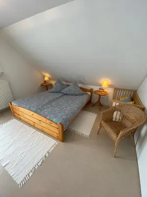 Ein Bett oder Betten in einem Zimmer der Unterkunft Haus Windjammer