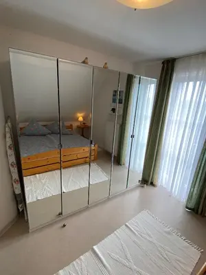 Ein Bett oder Betten in einem Zimmer der Unterkunft Haus Windjammer