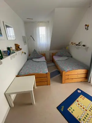 Ein Bett oder Betten in einem Zimmer der Unterkunft Haus Windjammer