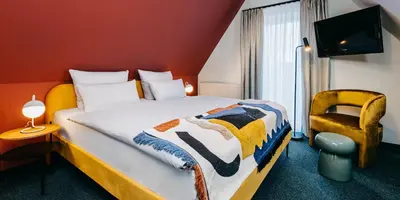 Ein Bett oder Betten in einem Zimmer der Unterkunft Boutique-Hotel Zur alten Post - Stammhaus