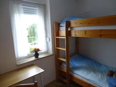 Ein Bett oder Betten in einem Zimmer der Unterkunft Ferienwohnung Meerleben