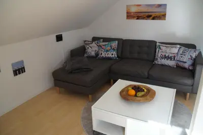 Ein Sitzbereich in der Unterkunft Ferienwohnung Robbe