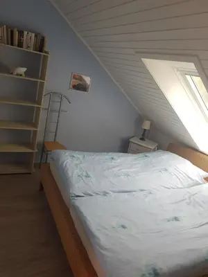 Ein Bett oder Betten in einem Zimmer der Unterkunft Ferienwohnung 2 - Leopold