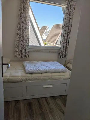 Ein Bett oder Betten in einem Zimmer der Unterkunft Dat lütte Strandhuus