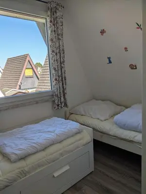 Ein Bett oder Betten in einem Zimmer der Unterkunft Dat lütte Strandhuus