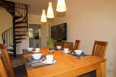 Ein Sitzbereich in der Unterkunft Ferienhaus Kampweg 15
