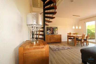 Ein Sitzbereich in der Unterkunft Ferienhaus Kampweg 15