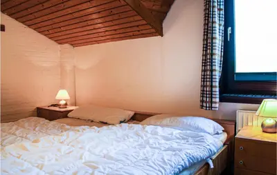 Ein Bett oder Betten in einem Zimmer der Unterkunft 2 Bedroom Cozy Apartment In Otterndorf