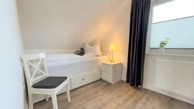 Ein Bett oder Betten in einem Zimmer der Unterkunft Wattn Traum 2