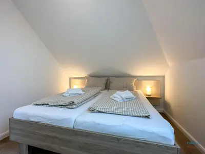 Ein Bett oder Betten in einem Zimmer der Unterkunft Refugium Storchenwiese Wohnung 2