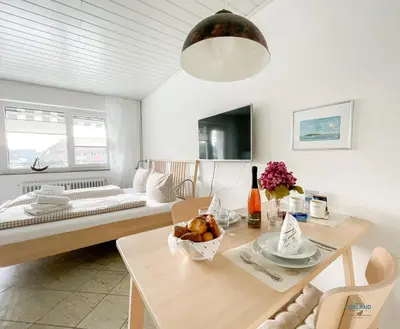 Ein Bett oder Betten in einem Zimmer der Unterkunft Strandappartement 15 Haus Kehrwieder