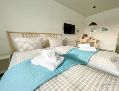 Ein Bett oder Betten in einem Zimmer der Unterkunft Strandappartement 15 Haus Kehrwieder