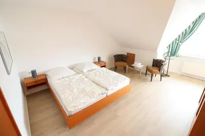 Ein Bett oder Betten in einem Zimmer der Unterkunft Haus Itjen Grün 1