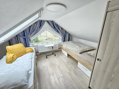 Ein Bett oder Betten in einem Zimmer der Unterkunft Nordlicht