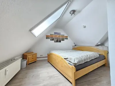 Ein Bett oder Betten in einem Zimmer der Unterkunft Nordlicht