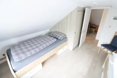 Ein Bett oder Betten in einem Zimmer der Unterkunft Nordlicht