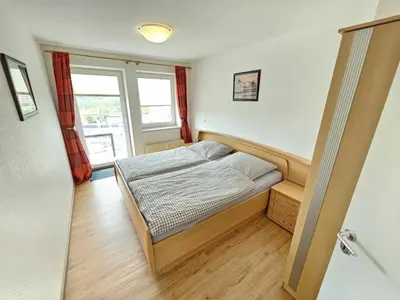 Ein Bett oder Betten in einem Zimmer der Unterkunft Nordseebrandung C4.5