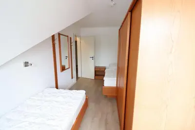 Ein Bett oder Betten in einem Zimmer der Unterkunft Haus Itjen Blau 4