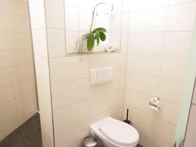 Ein Badezimmer in der Unterkunft Haus Itjen Gelb 2