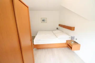 Ein Bett oder Betten in einem Zimmer der Unterkunft Haus Itjen Gelb 2