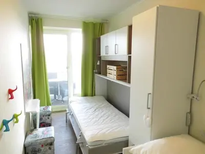 Ein Bett oder Betten in einem Zimmer der Unterkunft Nordseebrandung D3.1