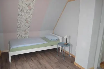 Ein Bett oder Betten in einem Zimmer der Unterkunft Nordseeidylle II