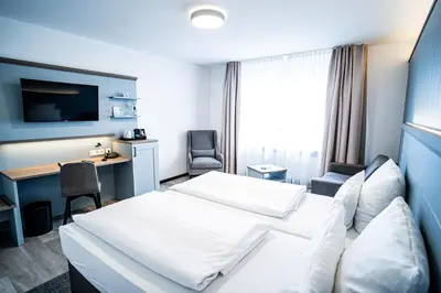 Ein Bett oder Betten in einem Zimmer der Unterkunft Hotel Seeschwalbe