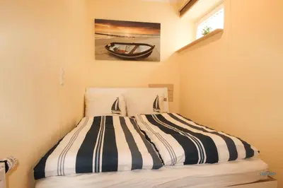 Ein Bett oder Betten in einem Zimmer der Unterkunft Haus Frauenpreis Wohnung 68