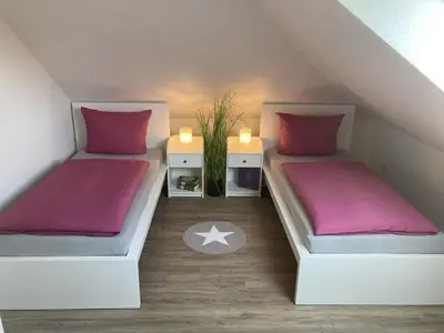 Ein Bett oder Betten in einem Zimmer der Unterkunft Ferienhaus Große Freiheit