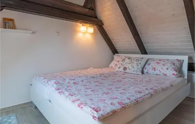 Ein Bett oder Betten in einem Zimmer der Unterkunft Cozy Apartment In Friedrichskoog-Spitze