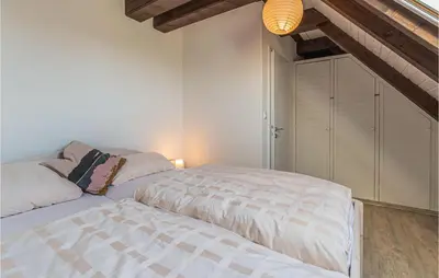 Ein Bett oder Betten in einem Zimmer der Unterkunft Cozy Apartment In Friedrichskoog-Spitze