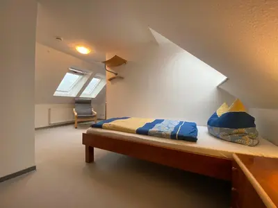 Ein Bett oder Betten in einem Zimmer der Unterkunft Duhner Brise, Ferienwohnung 5
