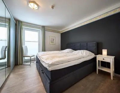 Ein Bett oder Betten in einem Zimmer der Unterkunft Haus an der Düne Ferienwohnung 5