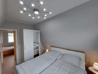 Ein Bett oder Betten in einem Zimmer der Unterkunft Am Ringwall 15