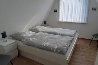 Ein Bett oder Betten in einem Zimmer der Unterkunft Am Ringwall 11