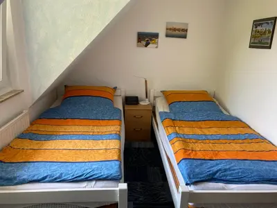 Ein Bett oder Betten in einem Zimmer der Unterkunft Haus Zyrus, Ferienwohnung 10