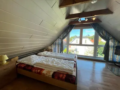 Ein Bett oder Betten in einem Zimmer der Unterkunft Voßhörn 19