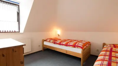 Ein Bett oder Betten in einem Zimmer der Unterkunft Haus Kerstin Duhnen Wohnung 9