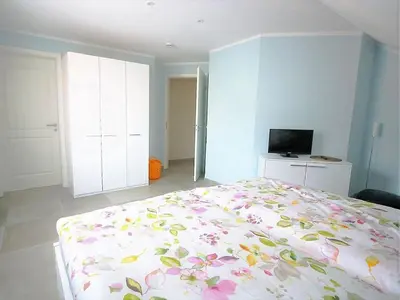 Ein Bett oder Betten in einem Zimmer der Unterkunft Ferienhaus Küstenhaus Wremen