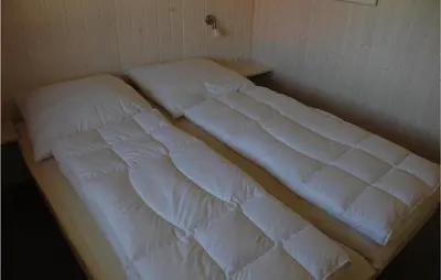 Ein Bett oder Betten in einem Zimmer der Unterkunft Friedrichskoog-Strandpark 14