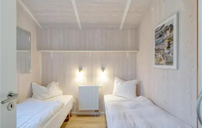 Ein Bett oder Betten in einem Zimmer der Unterkunft Friedrichskoog-Strandpark 11