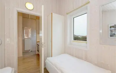 Ein Bett oder Betten in einem Zimmer der Unterkunft Friedrichskoog-Strandpark 11