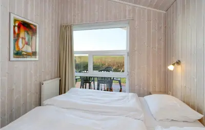 Ein Bett oder Betten in einem Zimmer der Unterkunft Friedrichskoog-Strandpark 15