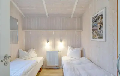 Ein Bett oder Betten in einem Zimmer der Unterkunft Friedrichskoog-Strandpark 22