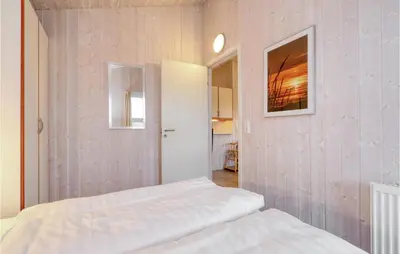 Ein Bett oder Betten in einem Zimmer der Unterkunft Friedrichskoog-Strandpark 22