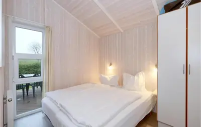 Ein Bett oder Betten in einem Zimmer der Unterkunft Friedrichskoog-Strandpark 24